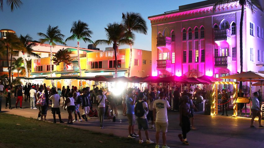 People enjoy themselves as they walk along Ocean Drive on March 18, 2021 in Miami Beach, Florida.