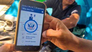 A migrant shows the CBP One App from the US Customs and Border Protection agency, to use to apply for an appointment to claim asylum, on a phone in Ciudad Juarez, Chihuahua state, Mexico, on May 10, 2023.