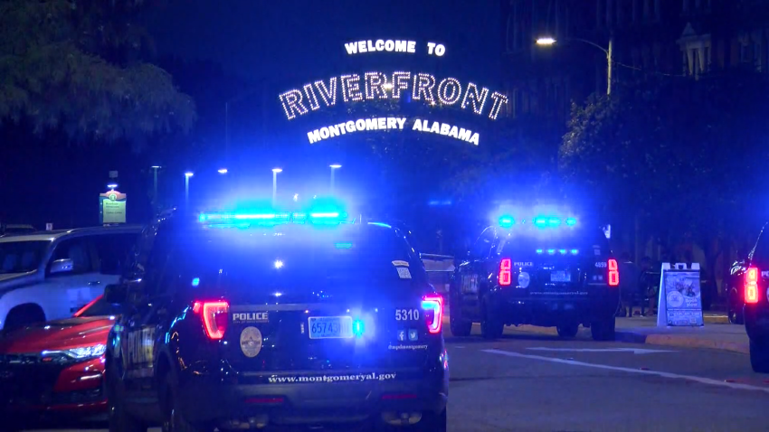 Police officers in front of Montgomery River Pier.