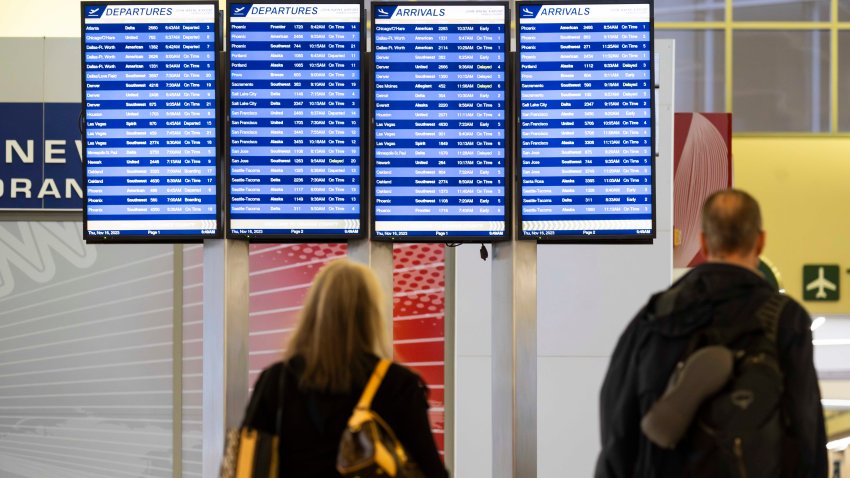 SANTA ANA, CA – November 16: Passengers walk by the list of flights at John Wayne Airport in Santa Ana, CA on Thursday, November 16, 2023. The Automobile Club of Southern California estimates a 3% increase of people traveling compared to last holiday season. (Photo by Paul Bersebach/MediaNews Group/Orange County Register via Getty Images)