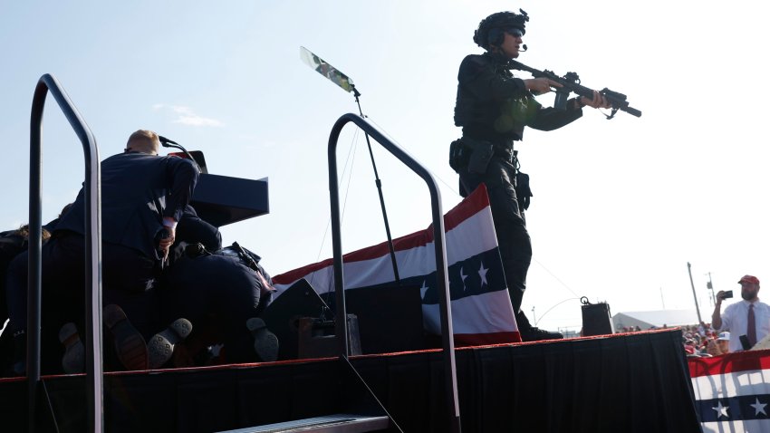 BUTLER, PENNSYLVANIA – JULY 13: Republican presidential candidate former President Donald Trump is rushed offstage during a rally on July 13, 2024 in Butler, Pennsylvania. Butler County district attorney Richard Goldinger said the shooter is dead after injuring former U.S. President Donald Trump, killing one audience member and injuring another in the shooting. (Photo by Anna Moneymaker/Getty Images)