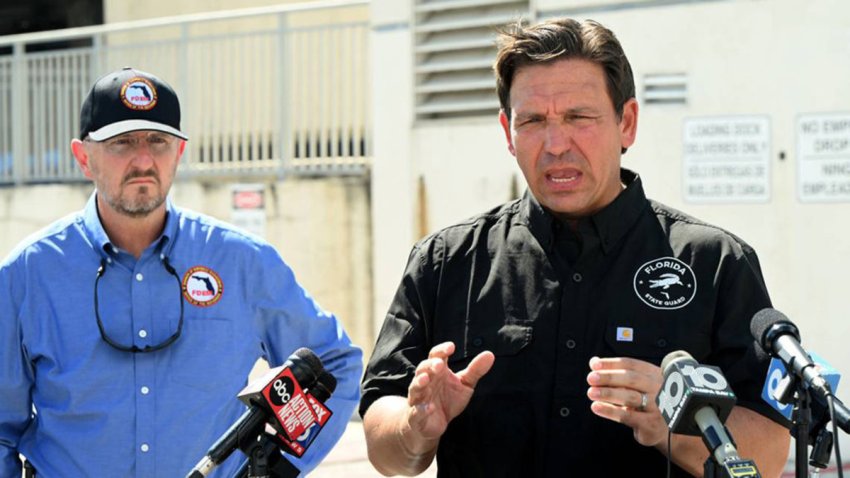 Florida Gov. Ron DeSantis, right, with FDEM Director Kevin Guthrie, left, speaks at a press conference at Manatee Memorial Hospital in Manatee County on Monday, Sept. 30, 2024. Florida Division of Emergency Management deployed a Tiger Dam around sections of the hospital before the arrival of Hurricane Helene. (Tiffany Tompkins/The Bradenton Herald/Tribune News Service via Getty Images)