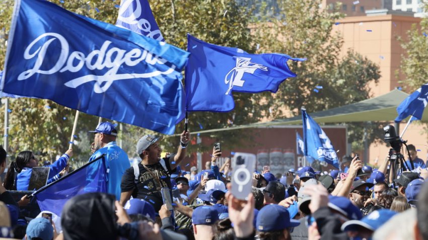 Los Angeles, CA – November 01: Dodgers players and fans celebrate their World Series Championship win as they kick off a parade at Gloria Molina Grand Park on Spring Street in front of Los Angeles City Hall in Los Angeles City Hall in Los Angeles Friday, Nov. 1, 2024. The Dodgers travel atop double-decker buses down First Street. The Los Angeles Dodgers won their 8th championship in franchise history with a 7-6 victory over the New York Yankees in Game 5 of the World Series. (Allen J. Schaben / Los Angeles Times via Getty Images)