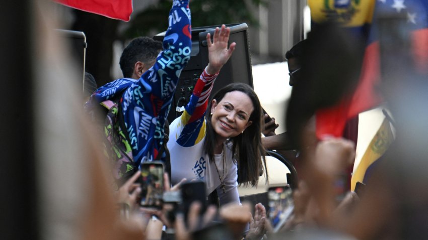 Venezuelan opposition leader Maria Corina Machado waves during a protest called by the opposition on the eve of the presidential inauguration, in Caracas on January 9, 2025. Venezuela is on tenterhooks facing demonstrations called by both the opposition and government supporters. Machado emerged from hiding to lead protests in Caracas against the swearing-in of Nicolas Maduro for a highly controversial third term as president. (Photo by Juan BARRETO / AFP) (Photo by JUAN BARRETO/AFP via Getty Images)