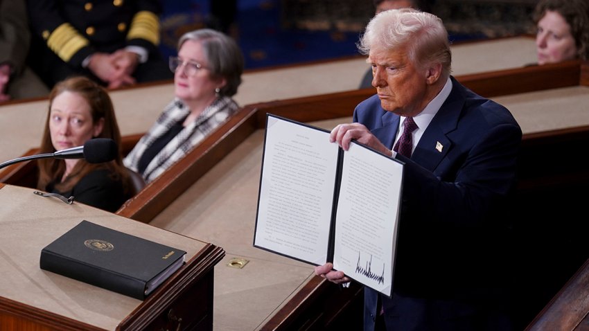 US President Donald Trump holds a signed executive order that renames a wildlife sanctuary in honor of late Jocelyn Nungaray during a joint session of Congress in the House Chamber of the US Capitol in Washington, DC, US, on Tuesday, March 4, 2025. Donald Trump’s primetime address Tuesday night from Capitol Hill, billed as a chronicle of his “Renewal of the American Dream,” comes at a critical juncture early in his second term, as voters who elected him to tackle inflation and improve the economy are beginning to weigh the impact of his agenda. Photographer: Al Drago/Bloomberg via Getty Images