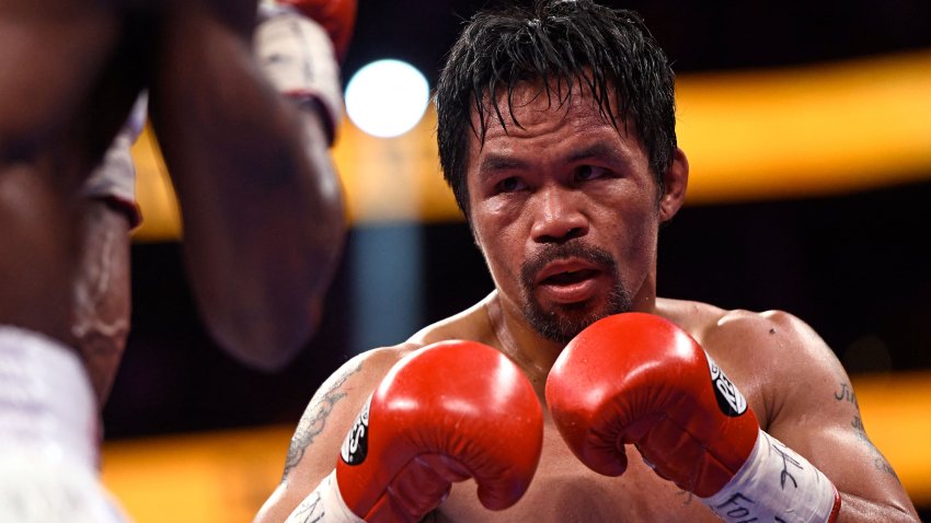Manny Pacquiao (R) of the Philippines fights against Yordenis Ugas of Cuba during the WBA Welterweight Championship boxing match at T-Mobile Arena in Las Vegas, Nevada on August 21, 2021. – Cuba’s Yordenis Ugas upset Manny Pacquiao to retain his WBA welterweight crown on Saturday, winning by unanimous decision after a bruising 12-round battle at the T-Mobile Arena. (Photo by Patrick T. FALLON / AFP) (Photo by PATRICK T. FALLON/AFP via Getty Images)